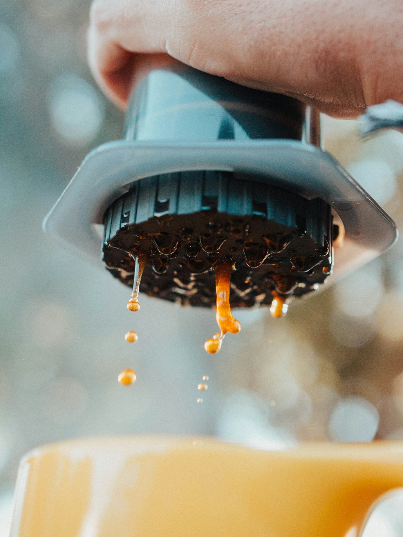 person brewing coffee